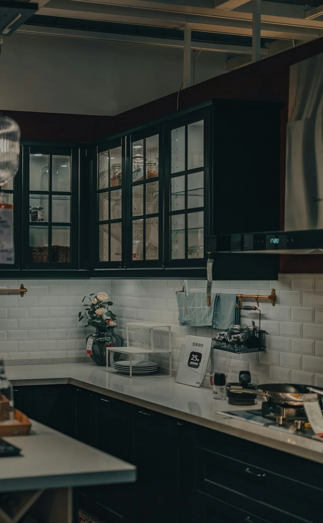 Side view of young ethnic male in uniform cleaning floor with mop while working in retro styled restaurant